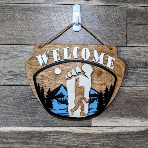 Enchanting Wood Sign: Bigfoot with Mountains backdrop - A Majestic Doorway to Adventure