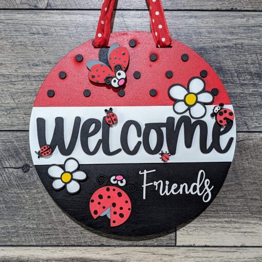 Quirky and Charming: 10-Inch Funny Cartoon Ladybug Front Door Hanger with 3D Design | Welcome Friends Sign in Red, Black, and White | Perfect for Lasercut Wood Sign Enthusiasts